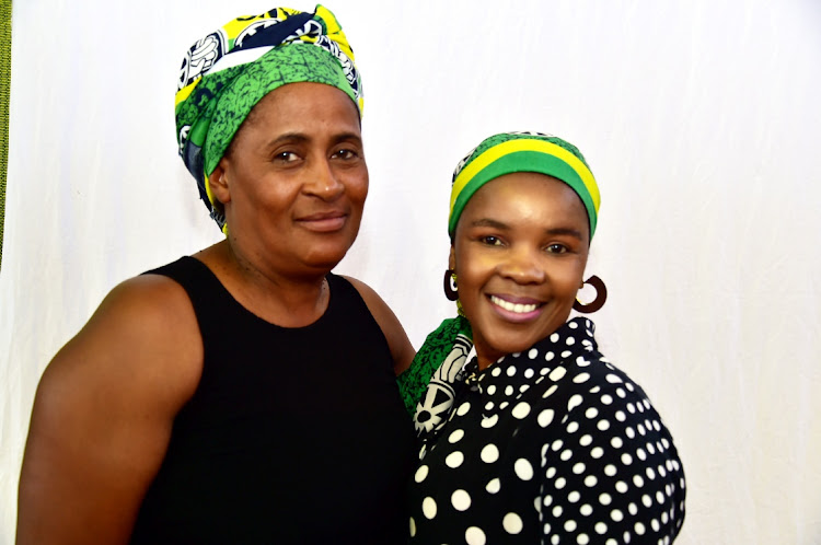 Lindelwa Sowazi, left, and Mandisa Twani attend the bi r t h d ay celebration for two residents turning 100 and 101, and hosted by