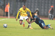 Thapelo Morena of Mamelodi Sundowns is challenged by Mashweu Mphahlele of Moroka Swallows in the DStv Premiership clash at Dobsonville Stadium on Monday night. 