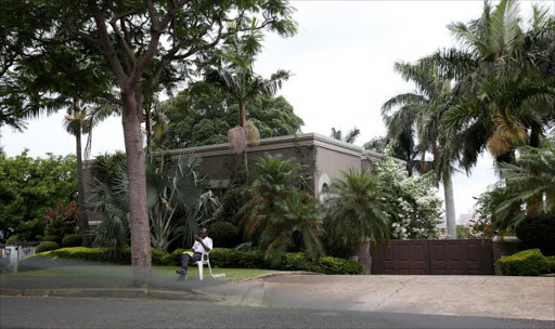 KEEPING AN EYE: A guard outside convicted fraudster Schabir Shaik's Morningside house in Durban Picture: THULI DLAMINI