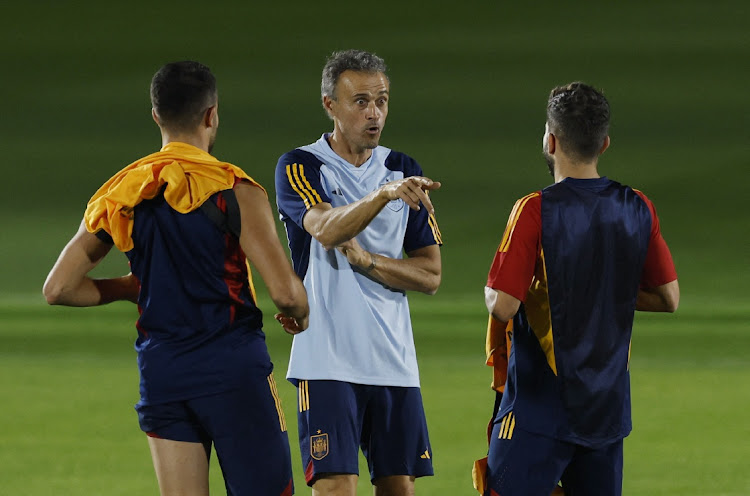 Spain coach Luis Enrique with Jordi Alba during training.