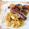 Thumbnail For Bratwurst, Sauerkraut, And Bacon Onion Potatoes On A Plate.