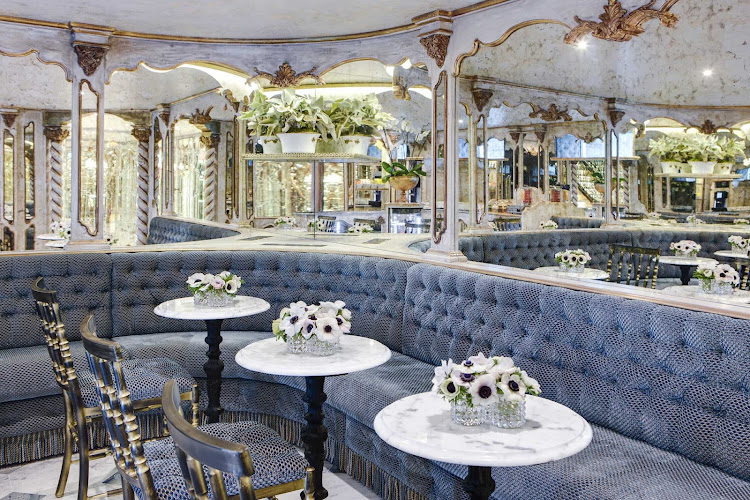 Enjoy a cappuccino by yourself, or meet new friends, at the Viennese Café on Uniworld's S.S. Maria Theresa. 