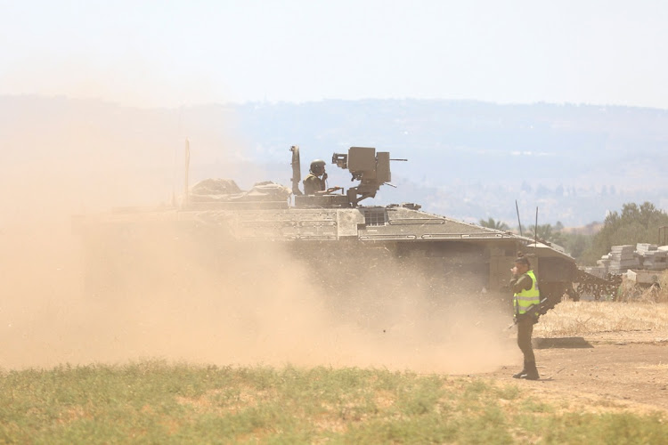 An Israeli forces member stands near a military vehicle near the Jalamah checkpoint, July 4 2023. Picture: RONEN ZVULUN/REUTERS