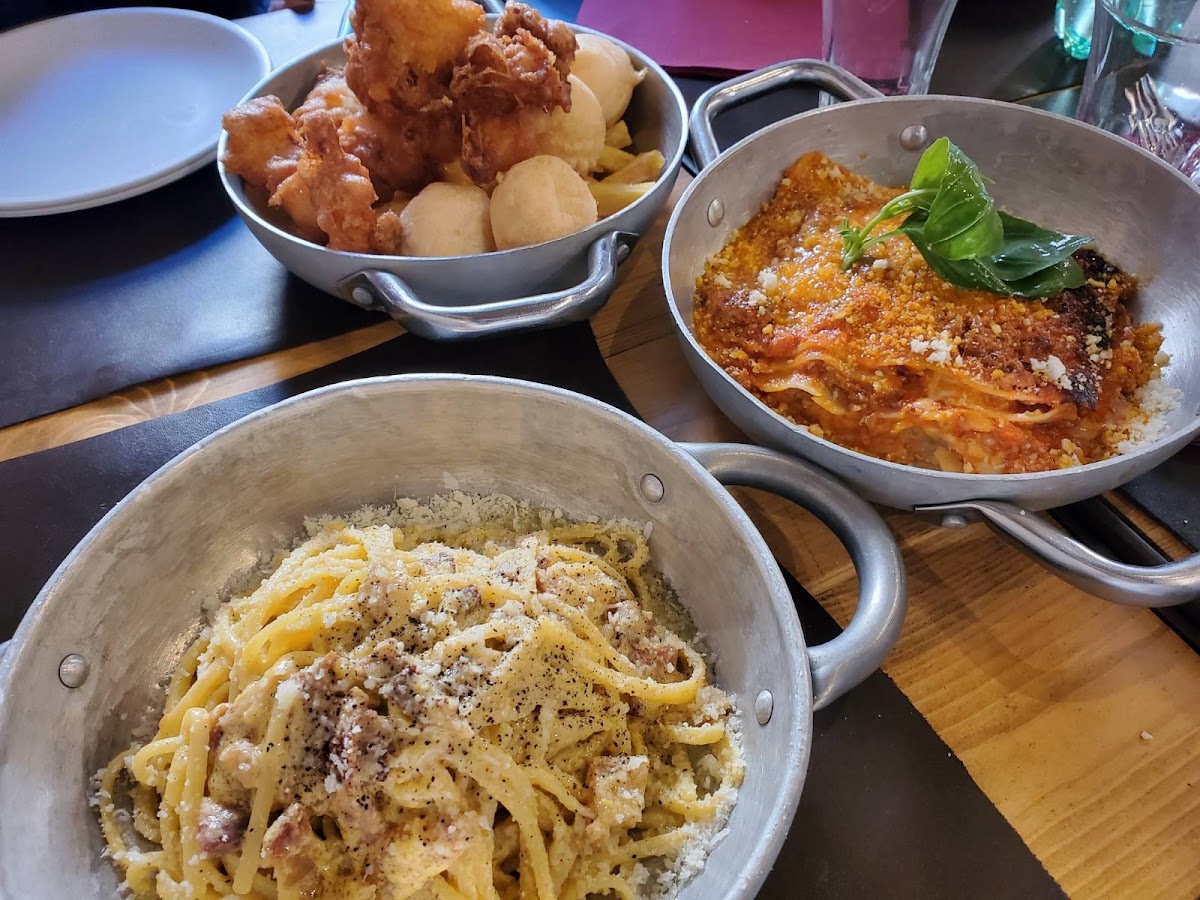 Pasta carbonara, lasagna al forno, and baccalá fritto.