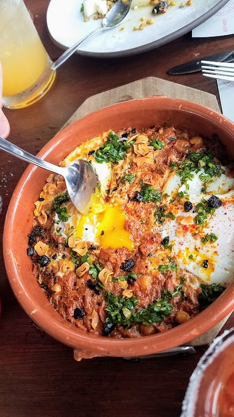 Bar Casa Vale Brunch Rotisserie Lamb Cazeula with artichoke, chickpea, salsa verde, and poached egg