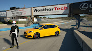 Falkiner and his Ford Focus ST 'pose' for a publicity shot at WeatherTech Raceway Laguna Seca.