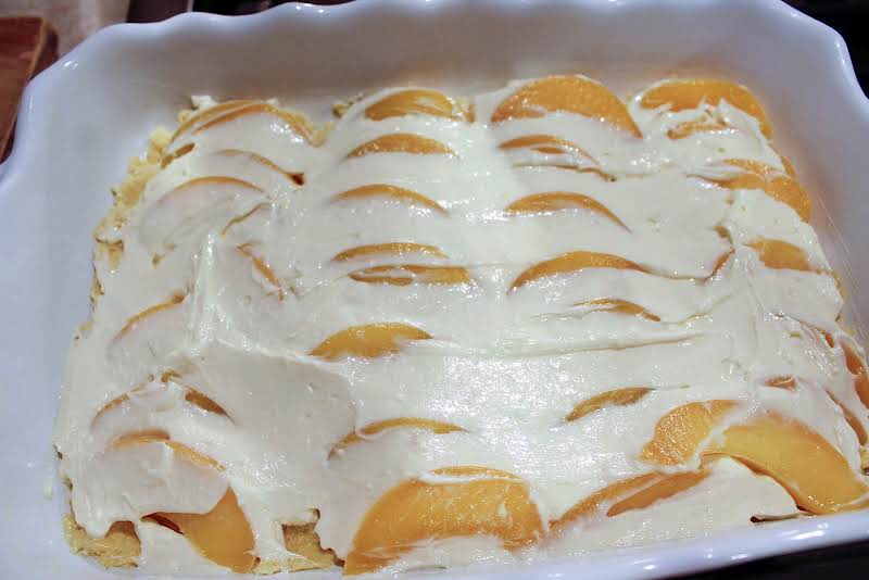 Cream Cheese Mixture Spread Over Peaches.