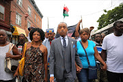 The Rev. Al Sharpton marches with family members of Eric Garner (right) and hundreds of others during a demonstration against the death of Eric Garner after he was taken into police custody in Staten Island on Thursday on July 19, 2014 in New York City. New York Mayor Bill de Blasio announced in a news conference yesterday that there will be a full investigation into the circumstances surrounding the death of Garner. The 400-pound, 6-foot-4 asthmatic, Garner (43) died after police put him in a chokehold outside of a convenience store for illegally selling cigarettes.  AFP Photo