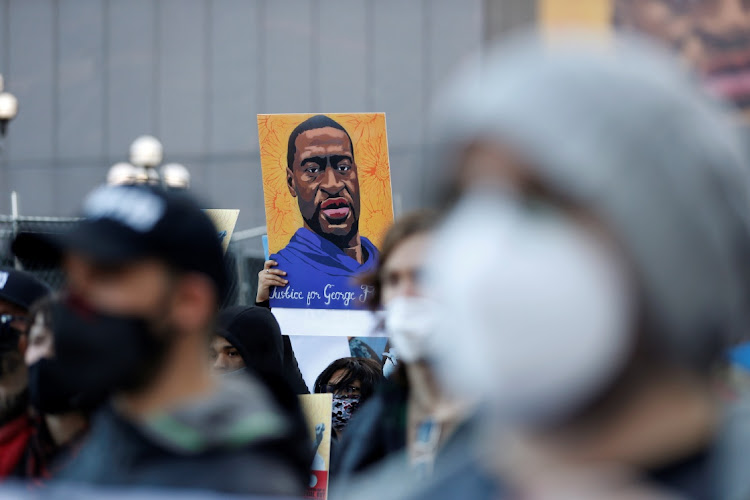 Protesters march on the first day of opening statements in the trial of former police officer Derek Chauvin, who is facing murder charges in the death of George Floyd, in Minneapolis, Minnesota, US, March 29, 2021.