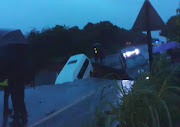 The R102 near GJ Crookes Hospital has caved in, almost swallowing a taxi and a car.