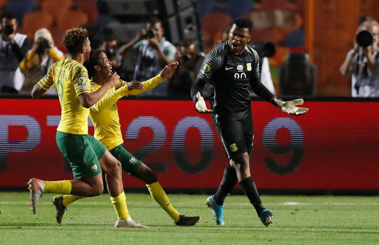 South Africa's Mondli Mpoto celebrates with teammates after winning a penalty shootout in the Africa Under 23 Cup of Nations third place playoff against Ghana at Cairo International Stadium, Cairo, Egypt, on November 22 2019.