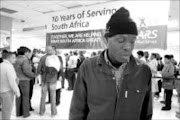 DESPONDENT: Doctor Baloyi was at the Carlton Centre in Johannesburg yesterday to hand in his tax return forms but was sent away because some documents were missing. Pic. Siphiwe Malaza.31/10/07. © Sowetan.