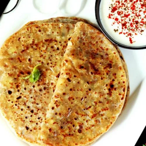 Onion Paratha (2 Pcs) With Curd & Pickle