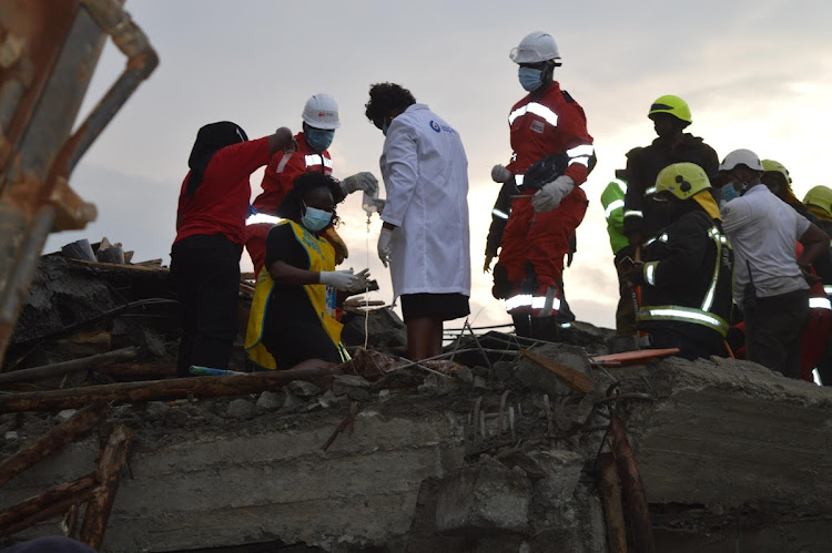 Paramedics at the scene of the collapsed building in Gachie.