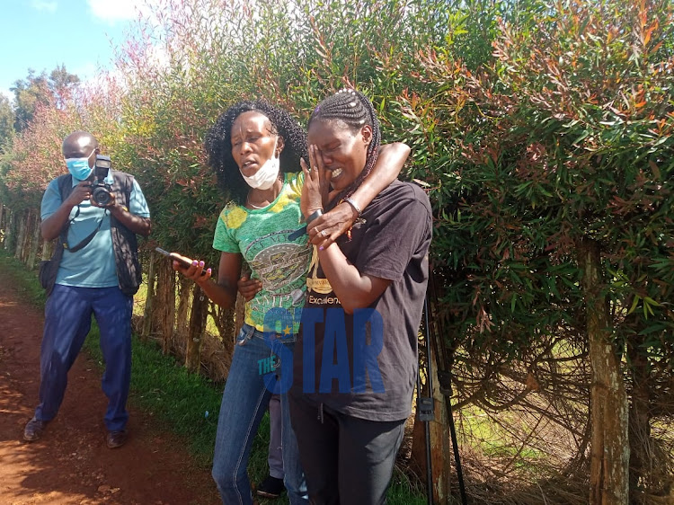 Former world 800m champion Janeth Jepkosgei (in green) and Selah Chepleting at the late Agnes Tirop's home in Iten.