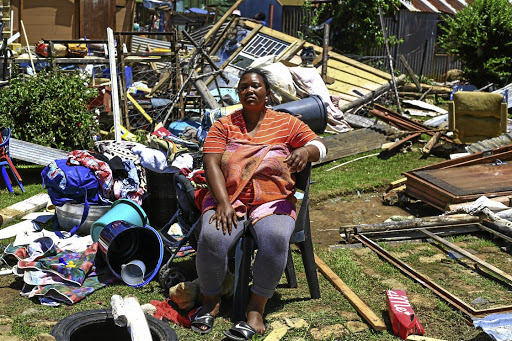 IN TATTERS Christina Sikhondo's shack collapsed around her and her children. She was cooking pap for the kids when the rain started. Then hail and heavy winds tore down her homePicture: Simphiwe Nkwali