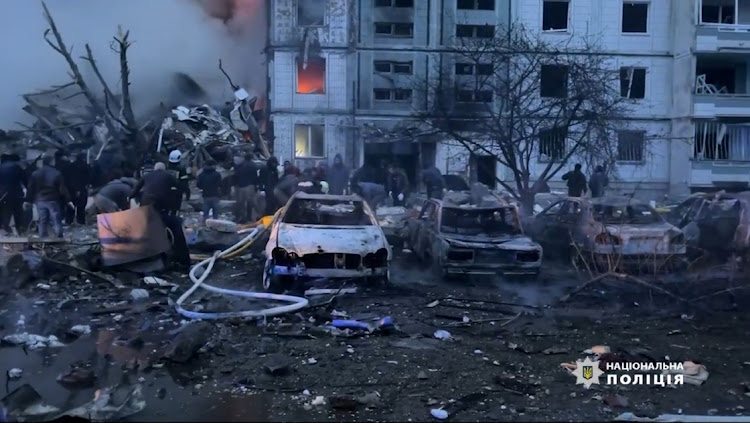 Destroyed vehicles near a heavily damaged residential building hit by a Russian missile, amid Russia’s attack on Ukraine, in the town of Uman, Cherkasy region, Ukraine, on Friday. Picture: NATIONAL POLICE OF UKRAINE/HANDOUT VIA REUTERS