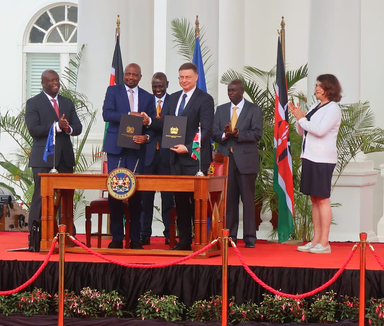 Investments, Trade and Industry CS Moses Kuria and European Commission Executive Vice-President and EU Trade Commissioner Valdis Dombrovskis and pose for a photo after the signing of declaration of intent on EU- Kenya Economic Partnership Agreement at State house Nairobi. Looking on is Trade PS Alfred K'Ombudo, President William Ruto, DP Rigathi Gachagua and EU Chief Negotiator Dora Correia on June 19, 2023.