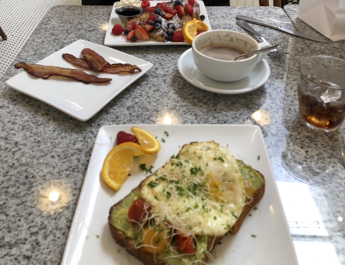 Avocado toast with two fried eggs- delicious! Also, french toast with fresh berries and a side of bacon- perfect!