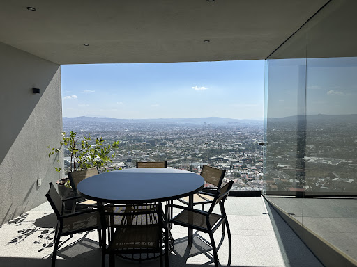 Table and chairs on balcony city view - Buy this luxury house in Santiago de Querétaro, 2 bedrooms
