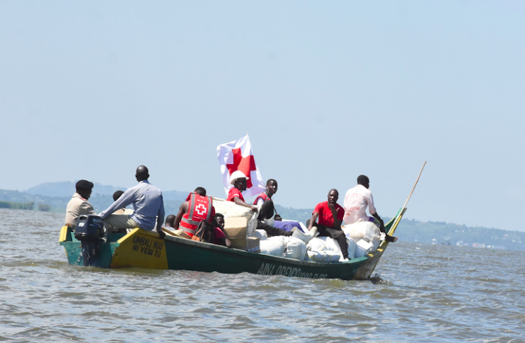 /home/kissfm/Downloads/Kenya Red Cross Volunteers transport non-food items to flood victims on Lake Victoria to Buluani Village, Busia County on May 15,2023.