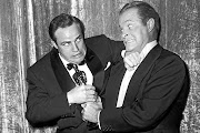 When Bob Hope jokingly tried to wrestle an Oscar statuette away from Marlon Brando, backstage at the March 1955 Academy
Awards, he was unwittingly dramatising the very purpose of the awards — keep the actors competing for the glamorous award so
they have little time left to fight for equal rights and equal pay in the industry. 