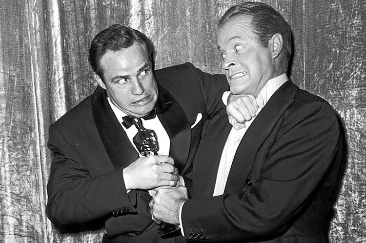 When Bob Hope jokingly tried to wrestle an Oscar statuette away from Marlon Brando, backstage at the March 1955 Academy Awards, he was unwittingly dramatising the very purpose of the awards — keep the actors competing for the glamorous award so they have little time left to fight for equal rights and equal pay in the industry.