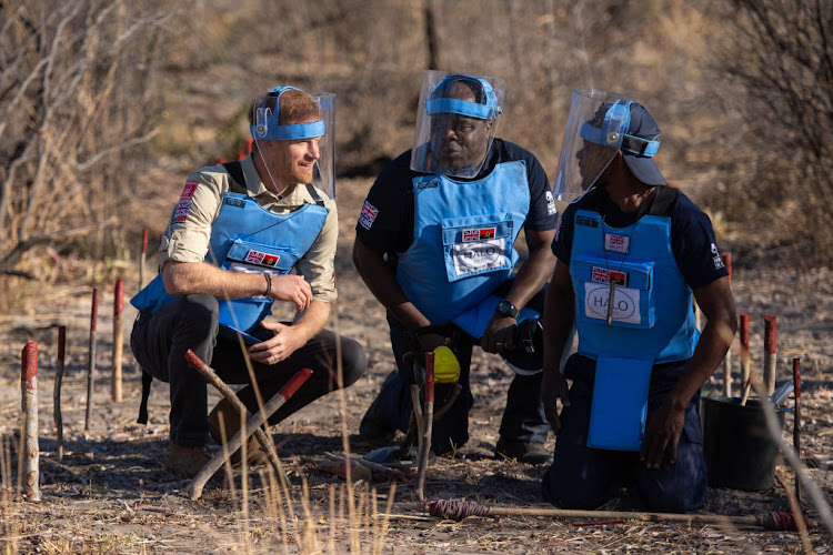 Prince Harry with Jose Antonio (centre) of the HALO Trust and a mine clearance worker in Dirico on September 27 2019 in Angola.