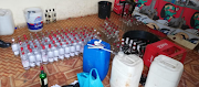 Bottles labelled 'Smirnoff Vodka' were lined up to be filled with dangerous home-brewed alcohol in Dududu, KZN.