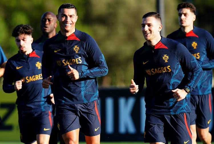 Portugal superstar Cristiano Ronaldo with Diogo Dalot during their national team training session at Cidade do Futebol FPF on March 21, 2023 in Oeiras, Portugal.