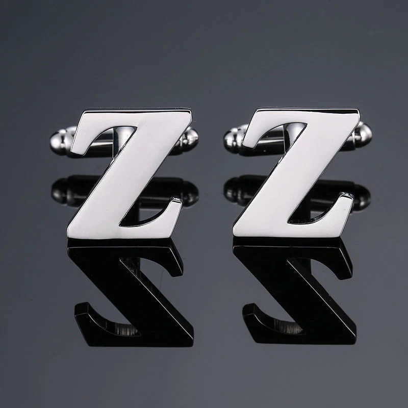 Heren manchetknopen met Franse en Engelse letters. Twee-talige elegantie aan je manchetten, een stijlvolle toevoeging voor elke outfit.
