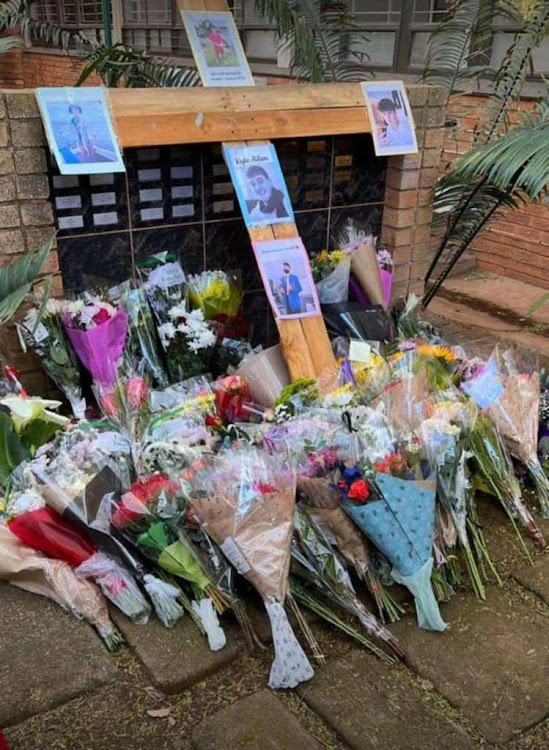 Flowers at the entrance to Northcliff High School in Johannesburg in memory of Kyle Aiton, 18, who died on Saturday.