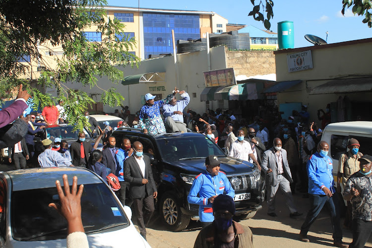 Wiper leader Kalonzo Musyoka with ANC counterpart Musalia Mudavadi wave to supporters in Machakos town on Tuesday, January 26, 2021