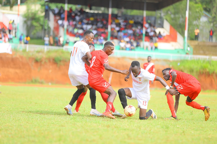 Shabana striker Cornelius Juma is sandwiched between Gusii FC players during their NSL encounter on Sunday