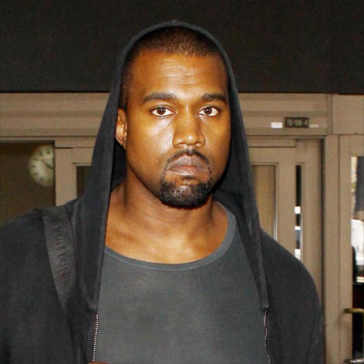 Kanye West clashes with paparazzi over questions about