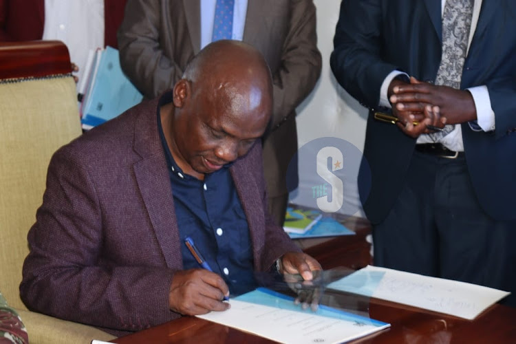 Water PS Paul Ronoh signs a Memorandum of Understanding with Bomet county government in an effort to reduce the loss of water, which is currently at 60 per cent at the county headquarters on December 30, 2022.