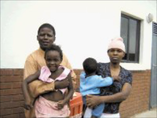 FEELING HOPELESS: Abram Rakabe and Selina Mmatseleng Rampjapedi with their children Mpho and Mapula. Mpho can't go to school because her mother does not have an ID. PIc. Ramatsiyi Moholoa.23/11/06. © Sowetan.