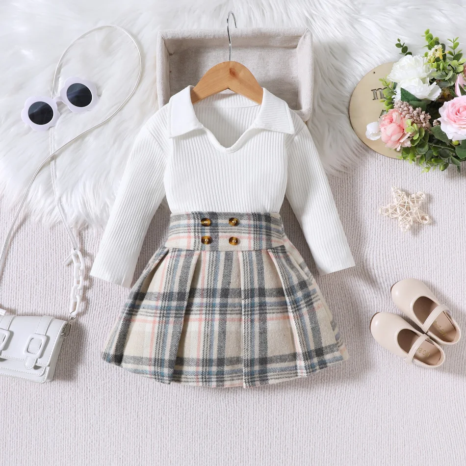 Conjunto infantil listrado manga longa com saia plissada xadrez estilo universitário, perfeito para brincar e ir à escola.