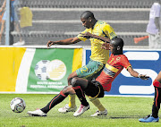 Phumelelo Bhengu of SA under-23s is tackled by Germano Diogo of Angola during the All Africa Games qualifier in February Picture: GALLO IMAGES