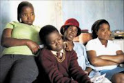 KIND HEARTED: Gladys Khumalo with the three Mncube orphans Pic: THULI DLAMINI. 07/09/2009. © Sowetan.