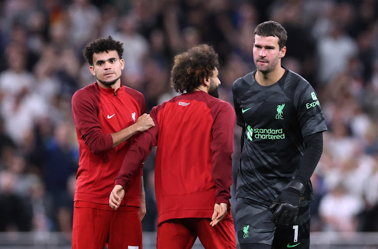 Liverpool's Alisson, Mohamed Salah and Luis Diaz look dejected after the Premier League match against Tottenham Hotspur at Tottenham Hotspur Stadium in London, Britain on Saturday.