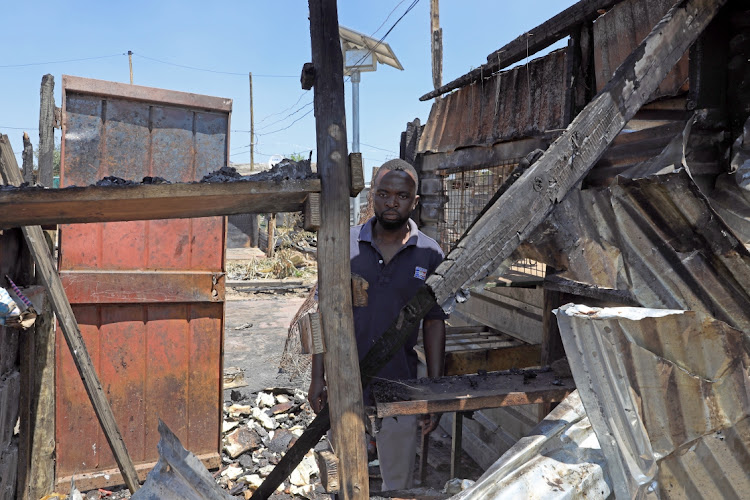 Ivo Fenioses lost his tuckshop stock when 18 shacks burnt to the ground at Thabo Mbeki Village informal settlement near Lion Park, Johannesburg.