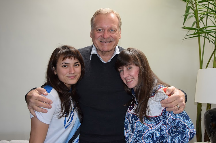 Russian rugby players Victoria Shalabodina and Tatiana Mikhailova meet former Springbok Ockie Oosthuizen on October 17, 2017 in Cape Town, South Africa.