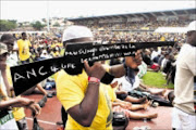 LOYAL CADRE: An ANC supporter showing off his 'umshini' at the election rally at Chatsworth Stadium yesterday. 01/03/09. Pic. Thuli Dlamini. © Sowetan.