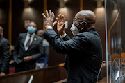 Former president Jacob Zuma waves to supporters during his corruption trial in Pietermaritzburg on October 26 2021.