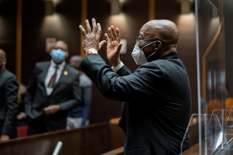 Former president Jacob Zuma waves to supporters during his corruption trial in Pietermaritzburg on October 26 2021.
