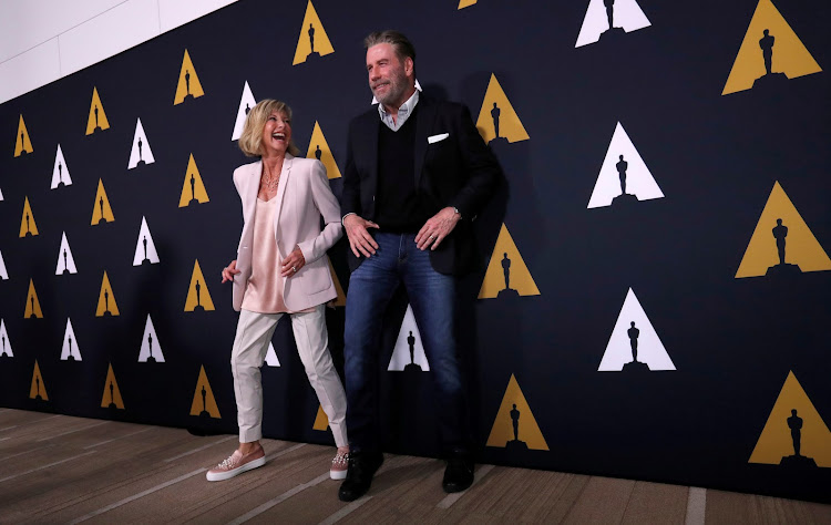 Cast members John Travolta and Olivia Newton-John dance at a 40th anniversary screening of "Grease" at the Academy of Motion Picture Arts and Sciences in Beverly Hills, California, U.S., August 15, 2018.