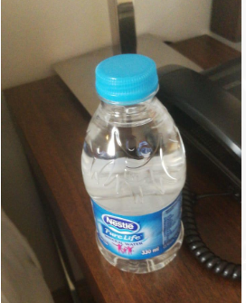 A single water bottle that was given to each of the students during their 14 day stay at the hotel.