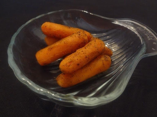 Carrot pickles marinated with olive oil, lemon juice, mustard seeds, turmeric and some more spices.