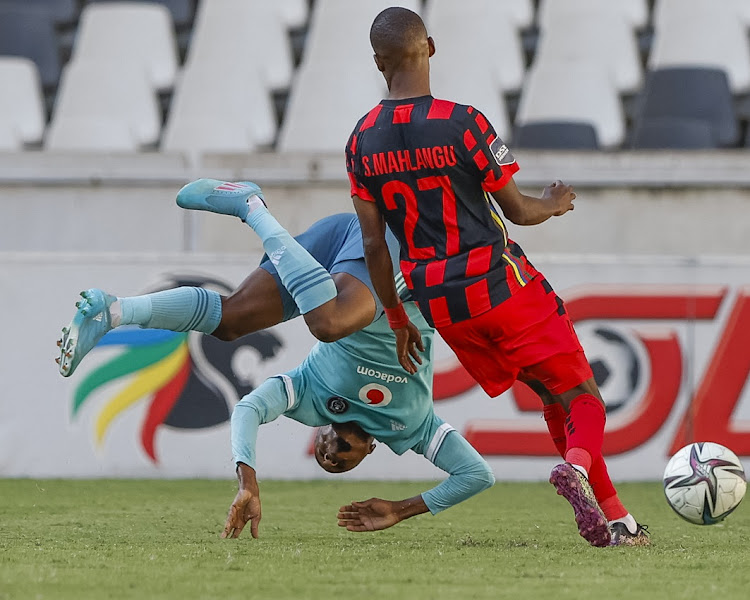 Bandile Shandu of Orlando Pirates takes a tumble in a challenge with Sphiwe Mahlangu of TS Galaxy FC in the DStv Premiership match at Mbombela Stadium in Nelspruit on May 2 2022.